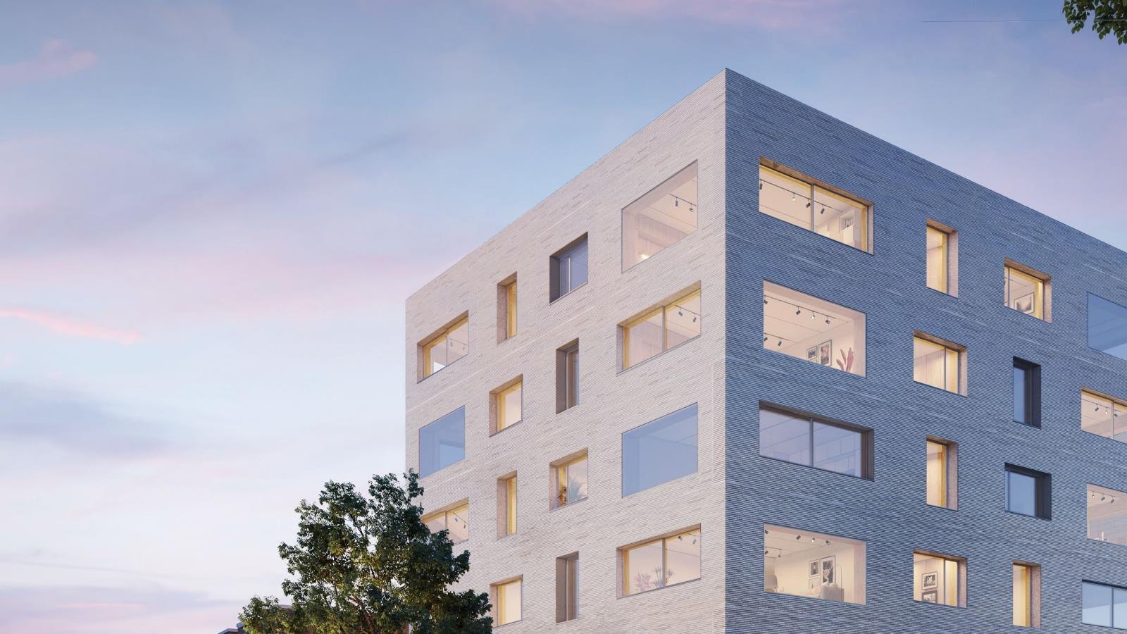 CGI of Corner House 1: pale brick five-storey apartment building at the canal edge, lit at dusk