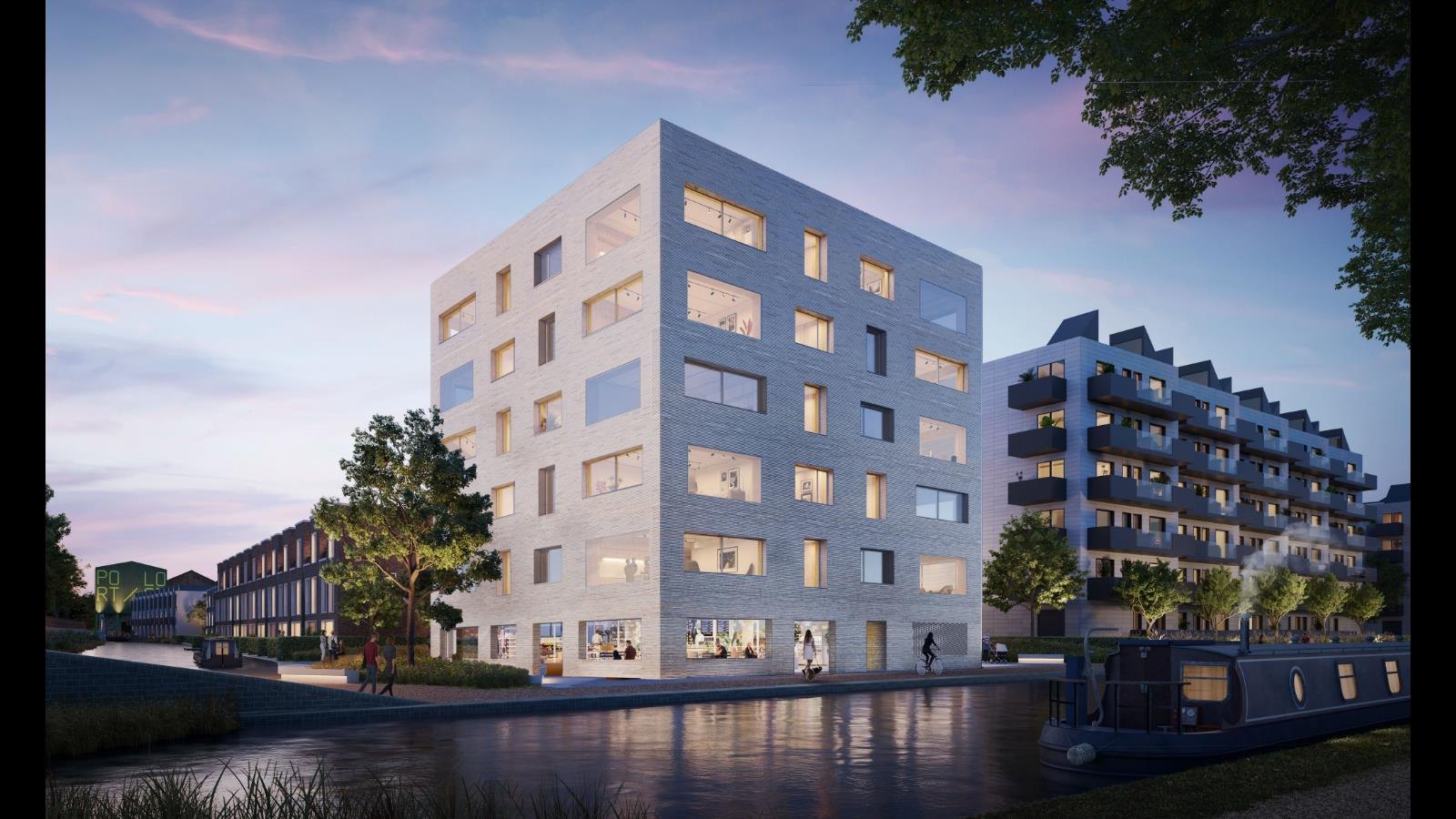 CGI detail of the Corner House 1 facade: pale brick with deep-set windows and lit interiors at dusk